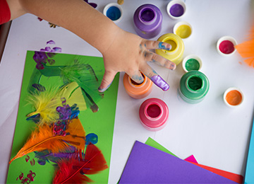 Image of child playing with sand